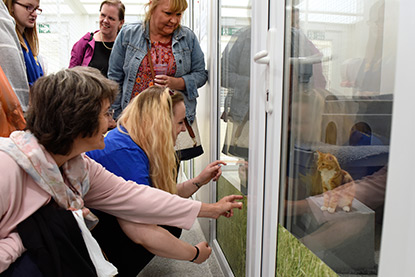 Visitors on a tour of Mitcham Homing Centre