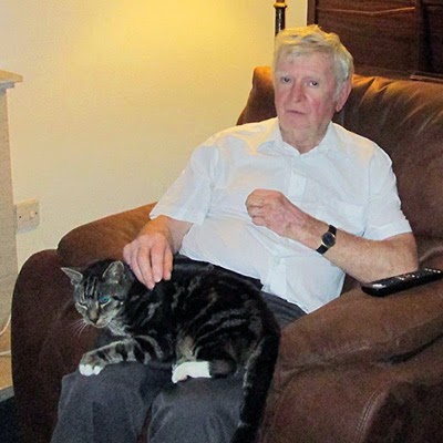 Elderly cat and owner